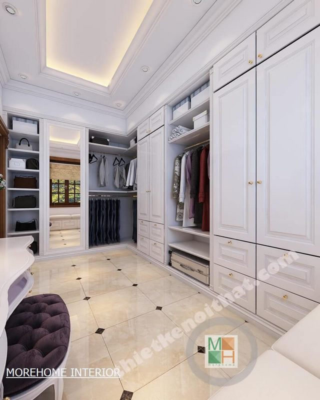 Mẫu tủ quần áo gỗ trắng với thiết kế kịch trần mang lại cảm giác sạch sẽ, sang trọng cho không gian.